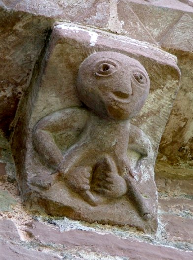 A 12th century sheela na gig on the church at Kilpeck, Herefordshire, England